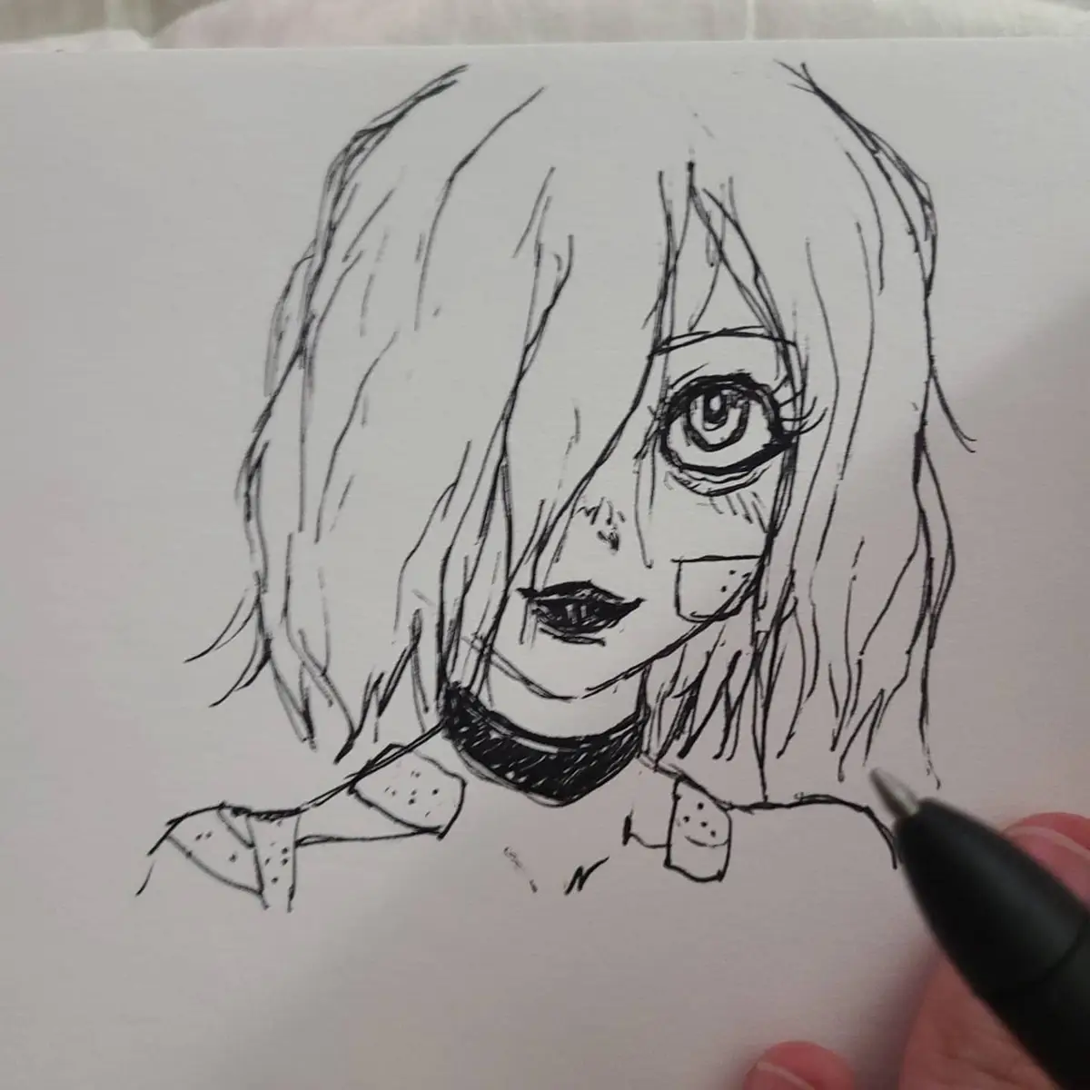 A hand-drawn black-and-white sketch of an anime-style female character with long hair, large eyes, and a choker, being drawn…