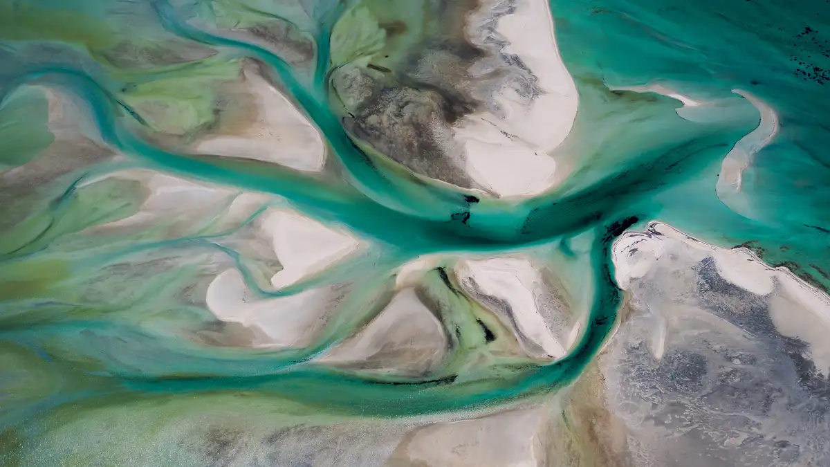 Overlooking Shark Bay, Australia's westernmost point, a masterpiece unfolds. Aerial views showcase the habitat of over…