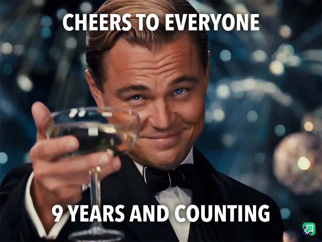 A man in a tuxedo holds up a champagne glass with a smug, knowing smile. White text overlaid at the top reads 'CHEERS TO…
