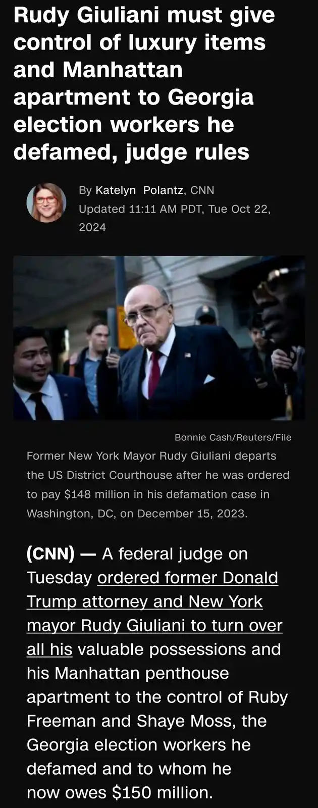 A screenshot of a CNN news article shows a photo of Rudy Giuliani walking out of a courthouse, surrounded by people. The…