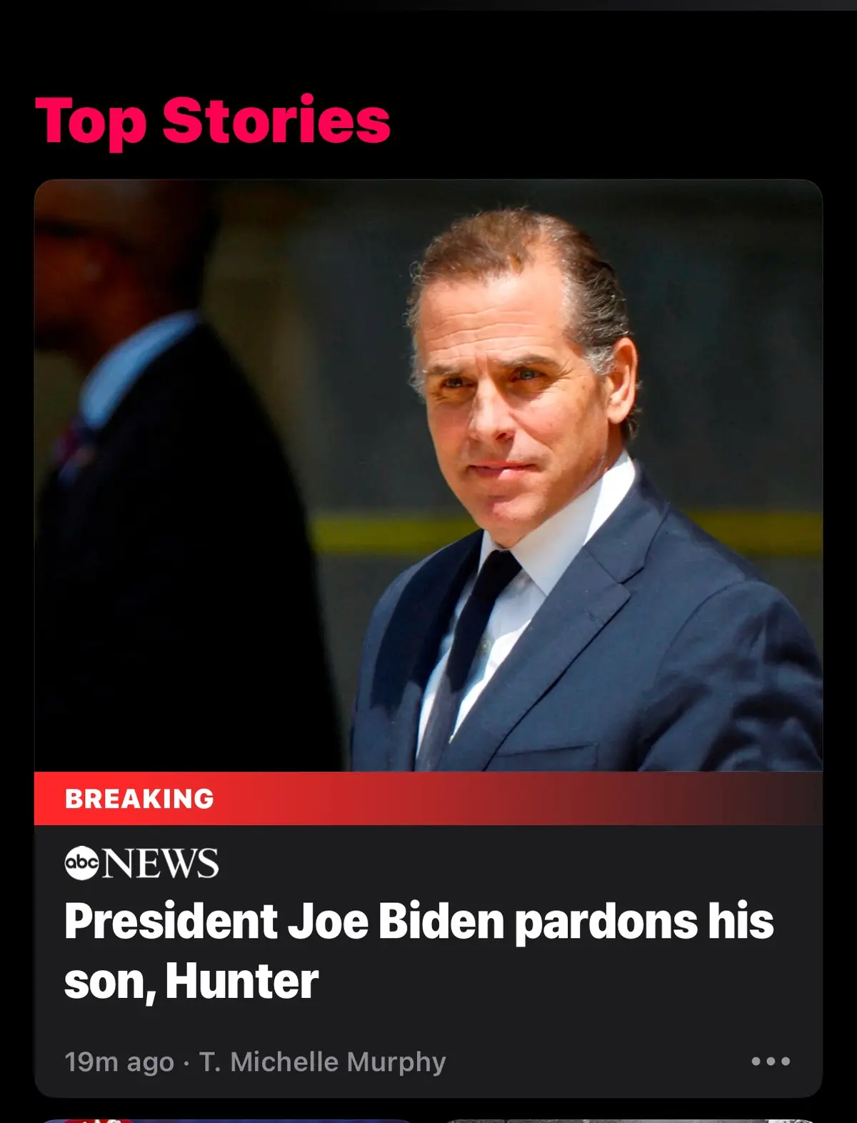 The image shows a news app interface with a 'Top Stories' header. A photo of Hunter Biden is displayed, overlaid with a…