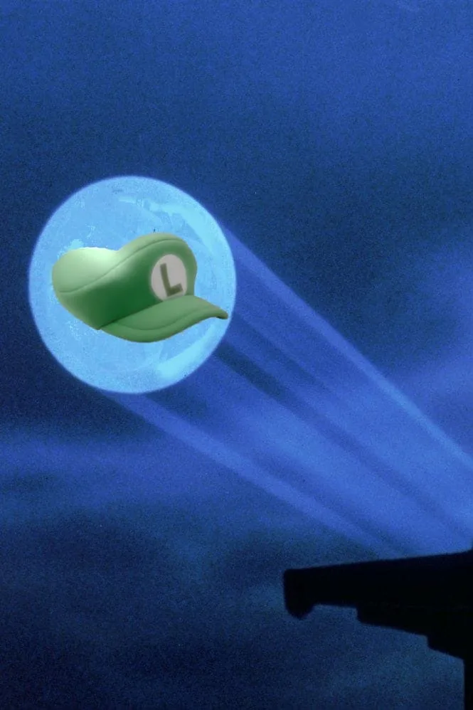 A green Luigi cap with a white 'L' logo is superimposed over a full moon in a dark blue night sky, with beams of light…