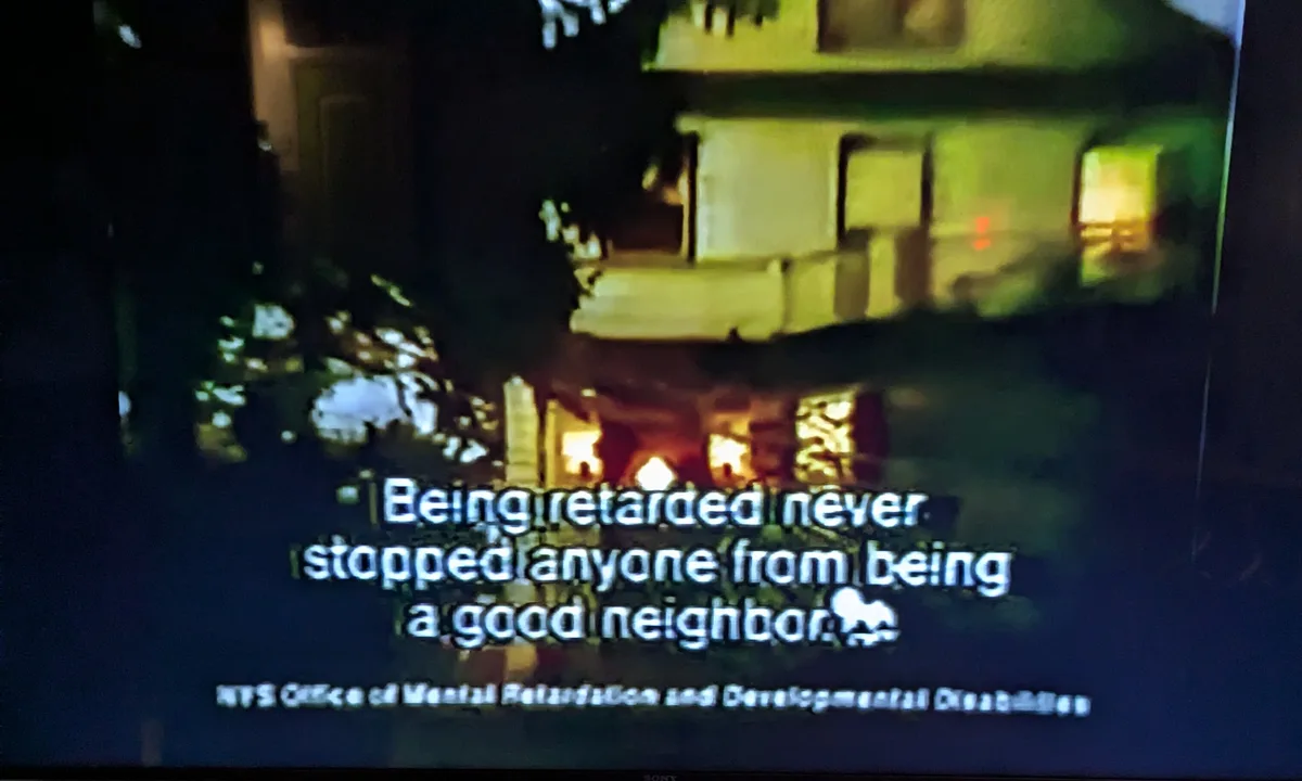 A nighttime photo of a house with lights on, overlaid with the text 'Being retarded never stopped anyone from being a good…