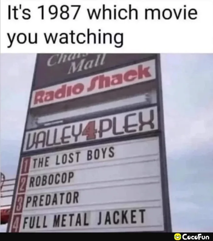A photo of a vintage movie theater marquee for 'Valley 4 Plex' under a 'Radio Shack' sign, listing four films: 'THE LOST…