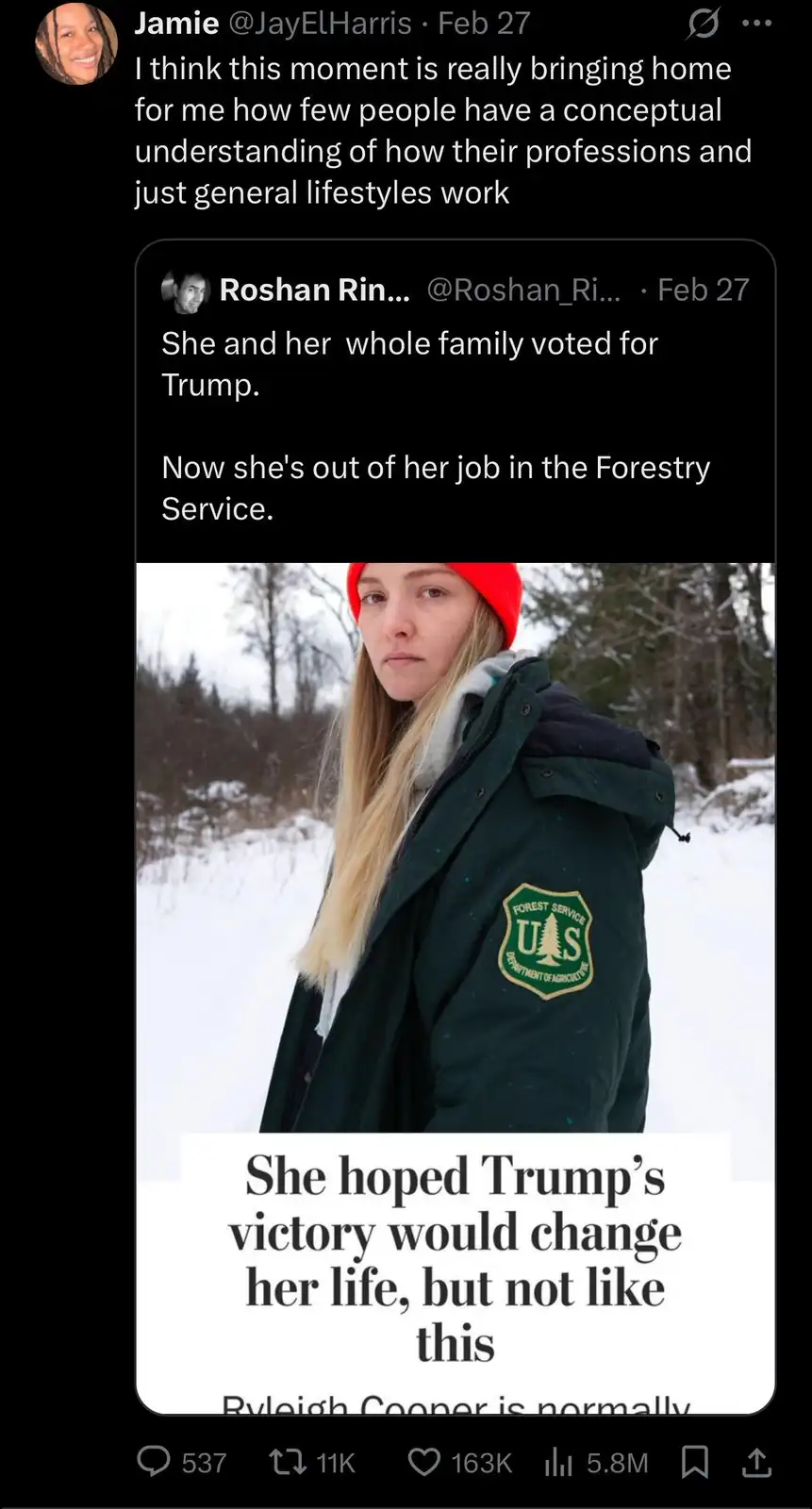 A woman in a green U.S. Forest Service jacket and red beanie stands in a snowy forest, looking somber. Overlaid text states…