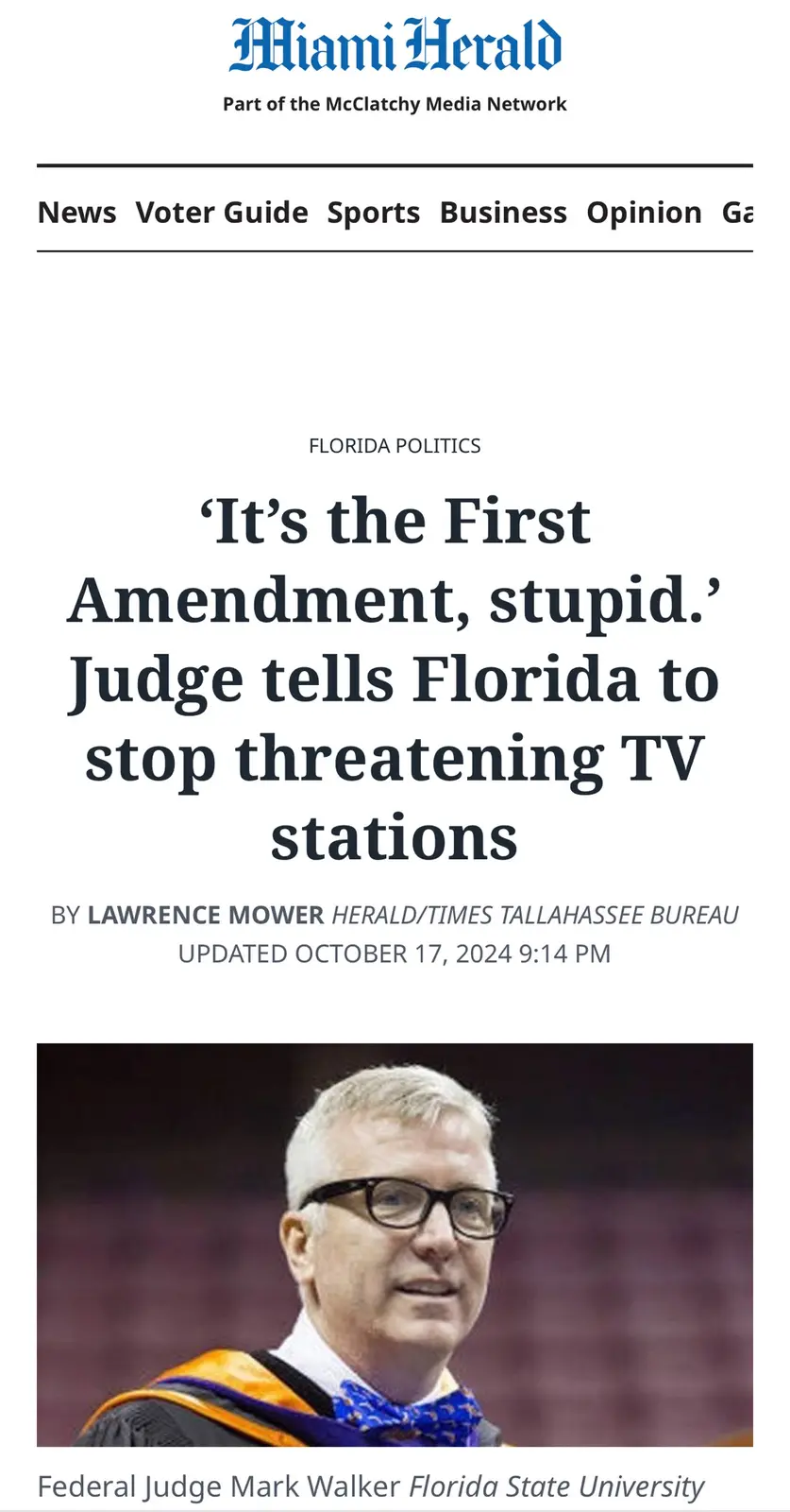 A screenshot of a Miami Herald news article shows a photo of Federal Judge Mark Walker wearing a graduation gown and a blue…