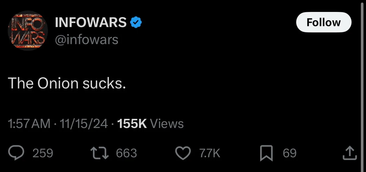 A screenshot of a tweet from the verified Twitter account @infowars, which displays the text 'The Onion sucks.' The tweet…
