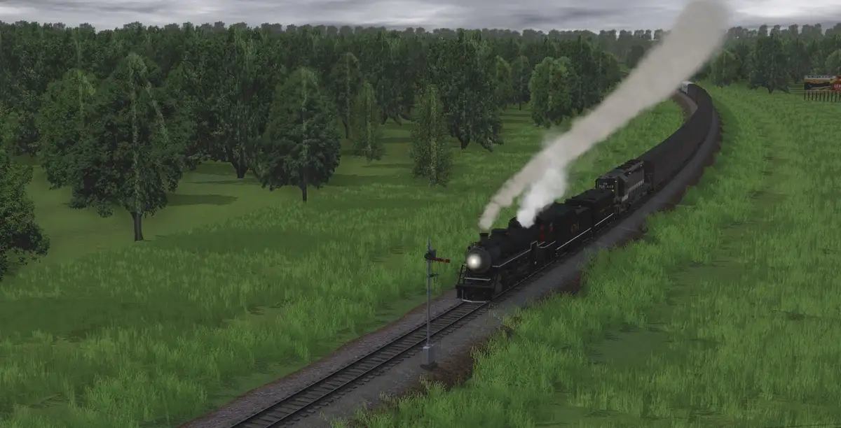 A steam locomotive pulls a long train through a grassy, tree-lined landscape under an overcast sky, emitting a large plume…