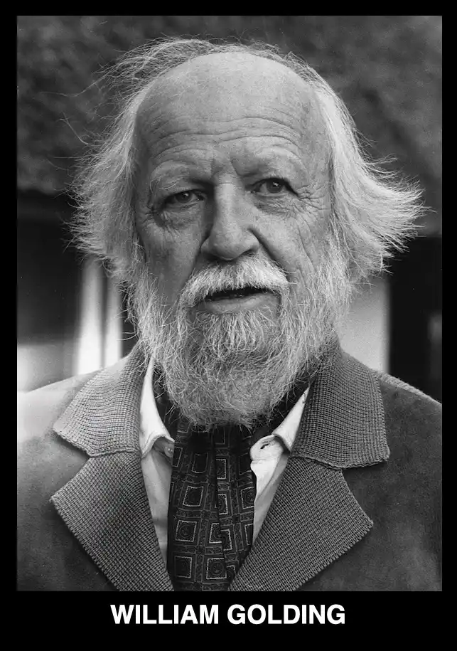 A black-and-white portrait of an elderly man with a long white beard and wild white hair, wearing a patterned tie and…