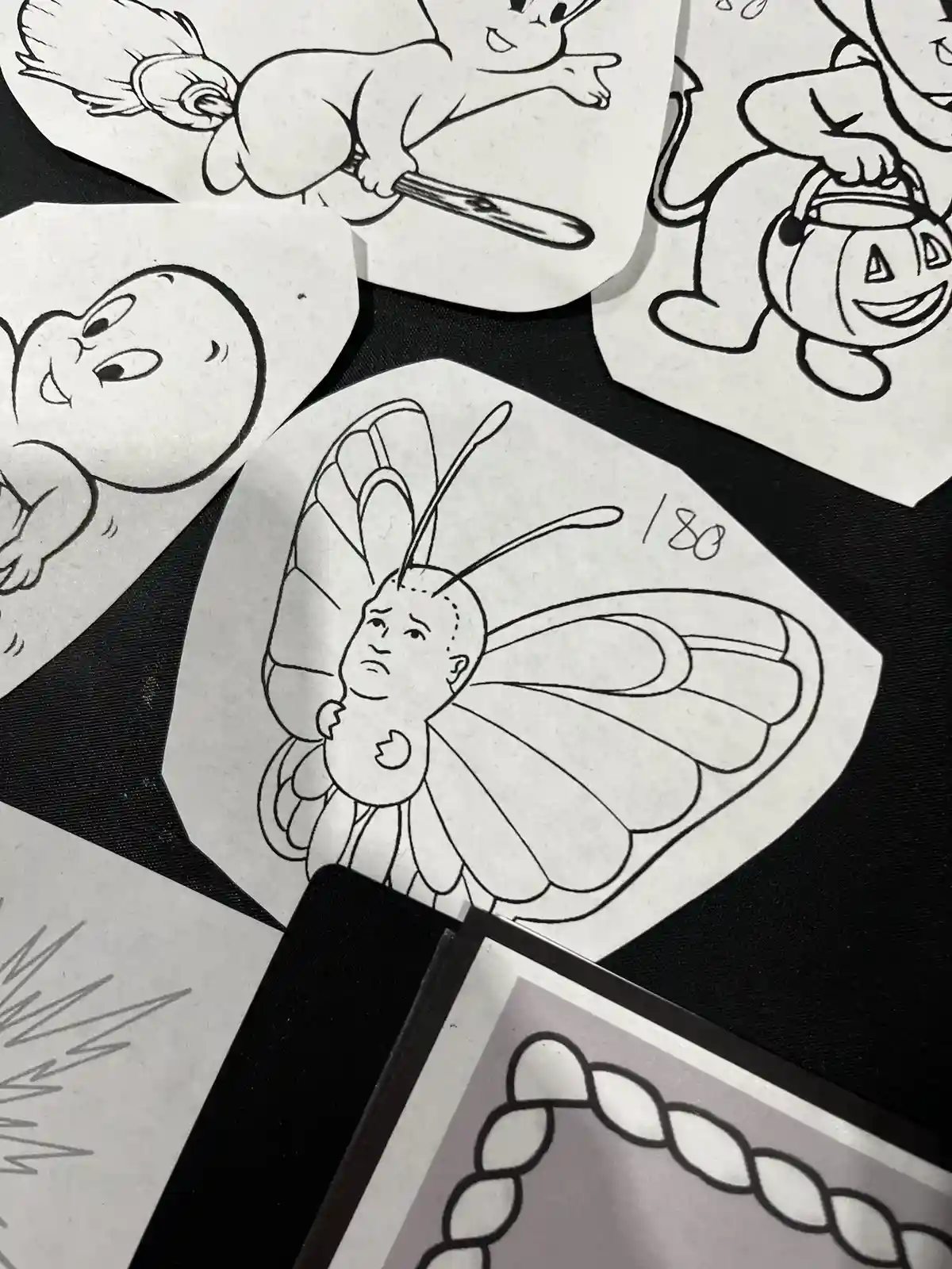 A collection of black-and-white coloring pages featuring cartoon characters like a ghost, a witch, and a jack-o'-lantern…