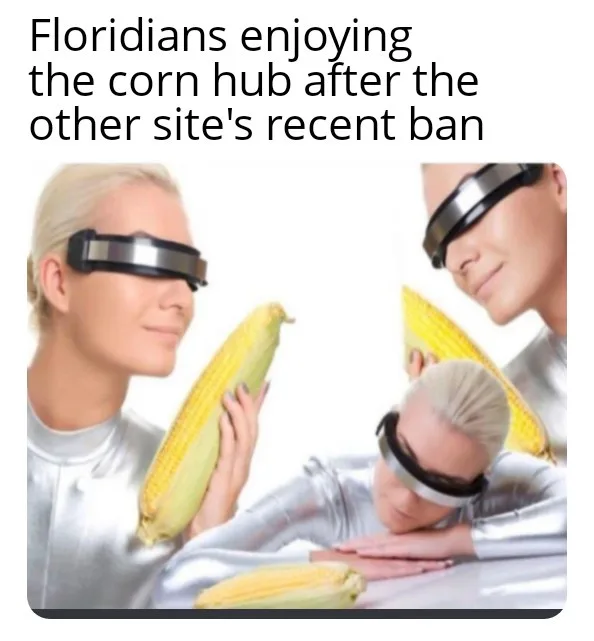Three people in silver futuristic outfits and black blindfolds are shown holding or resting near ears of corn. The text…