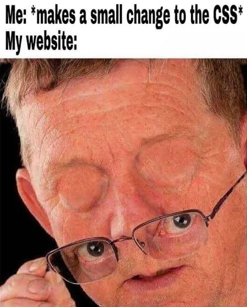 A close-up photo of a man with glasses, his eyes wide open and bulging in a startled expression, as if reacting to something…