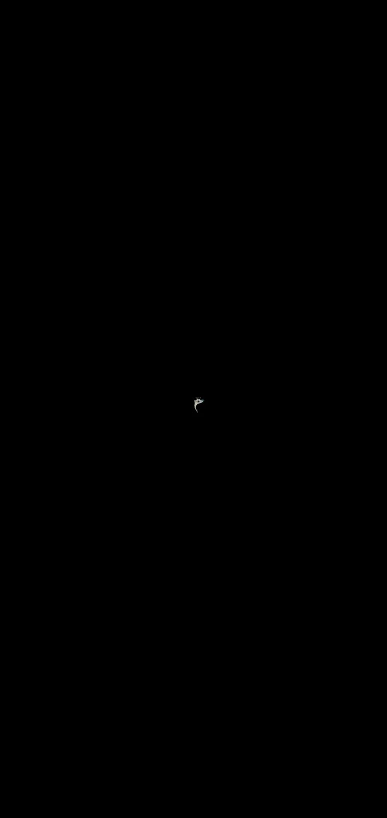 A small, dark image shows only the eyes and nose of a cat peeking from the center of a black background. The overlaid text…