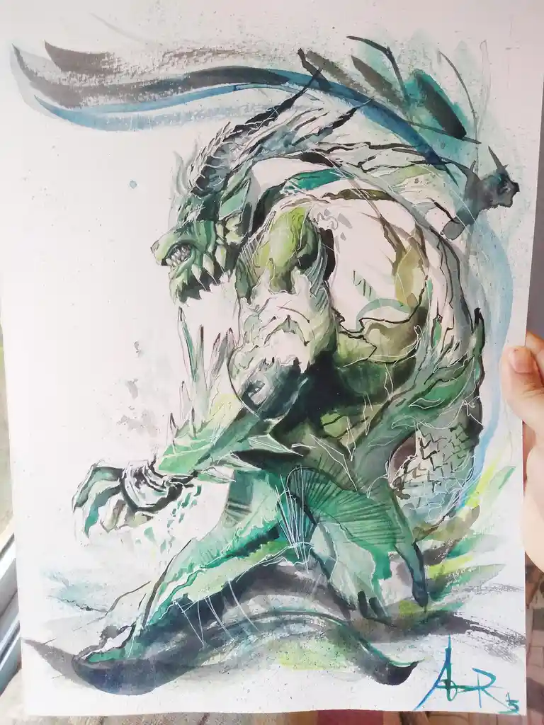 A hand holds up a watercolor painting of a green, muscular, dragon-like creature with sharp teeth, claws, and flowing…