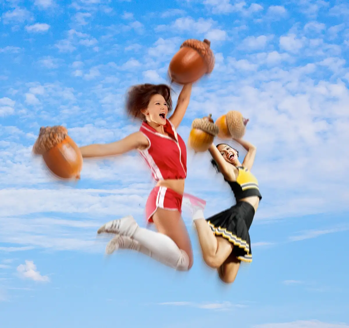 Two cheerleaders in mid-air against a blue sky with clouds, both holding and throwing large acorns with joyful expressions…