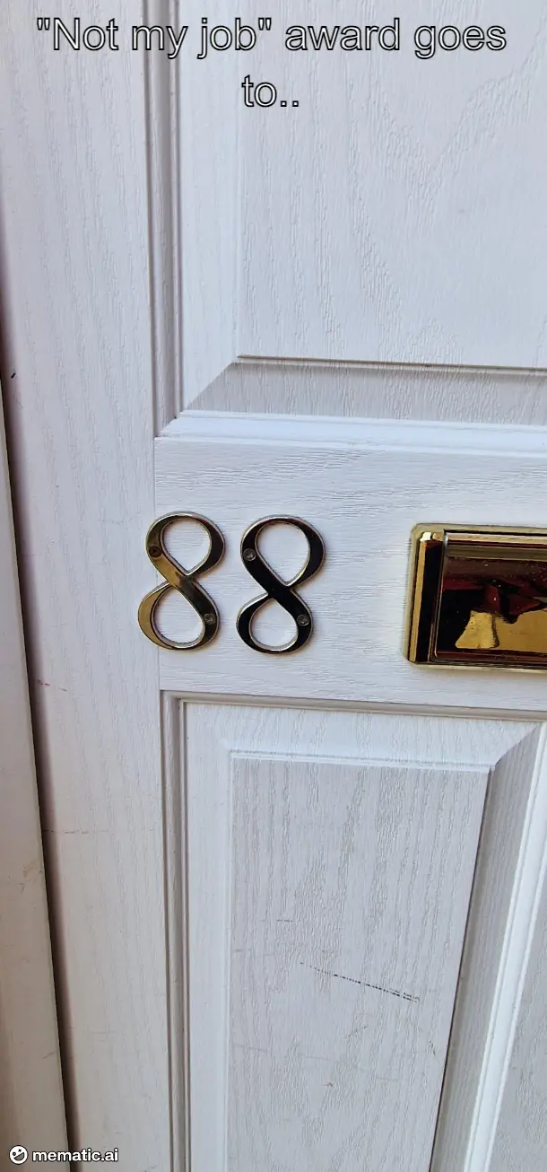 A close-up photo of a white wooden door with gold-colored house numbers '88' mounted on it, next to a gold mail slot. The…