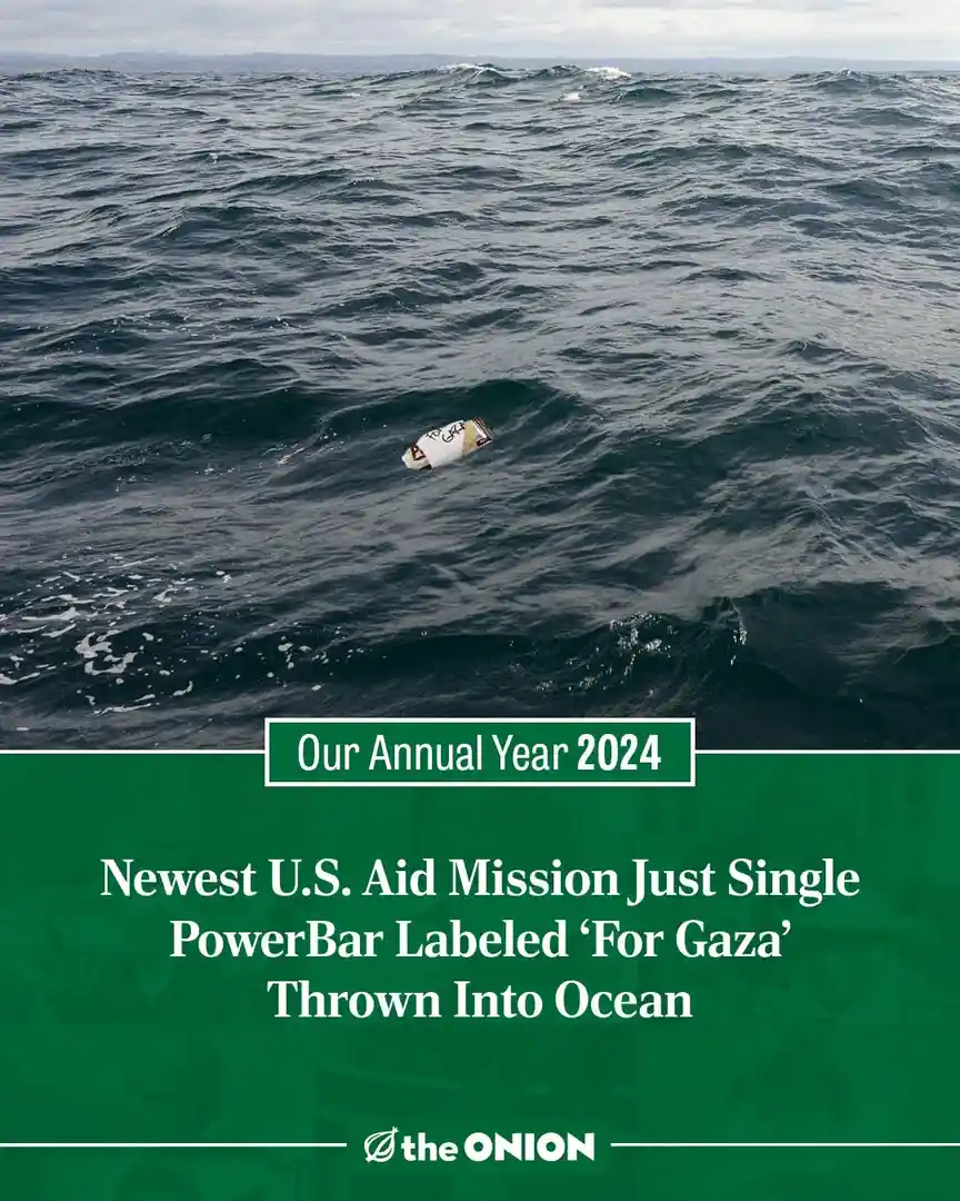 A single PowerBar wrapper floats alone in a vast, choppy ocean under an overcast sky. Overlaid text reads 'Our Annual Year…