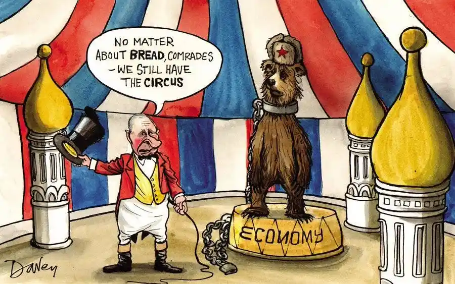 A cartoon depicts a ringmaster in a red jacket and bow tie holding a top hat, standing before a chained bear wearing a red…