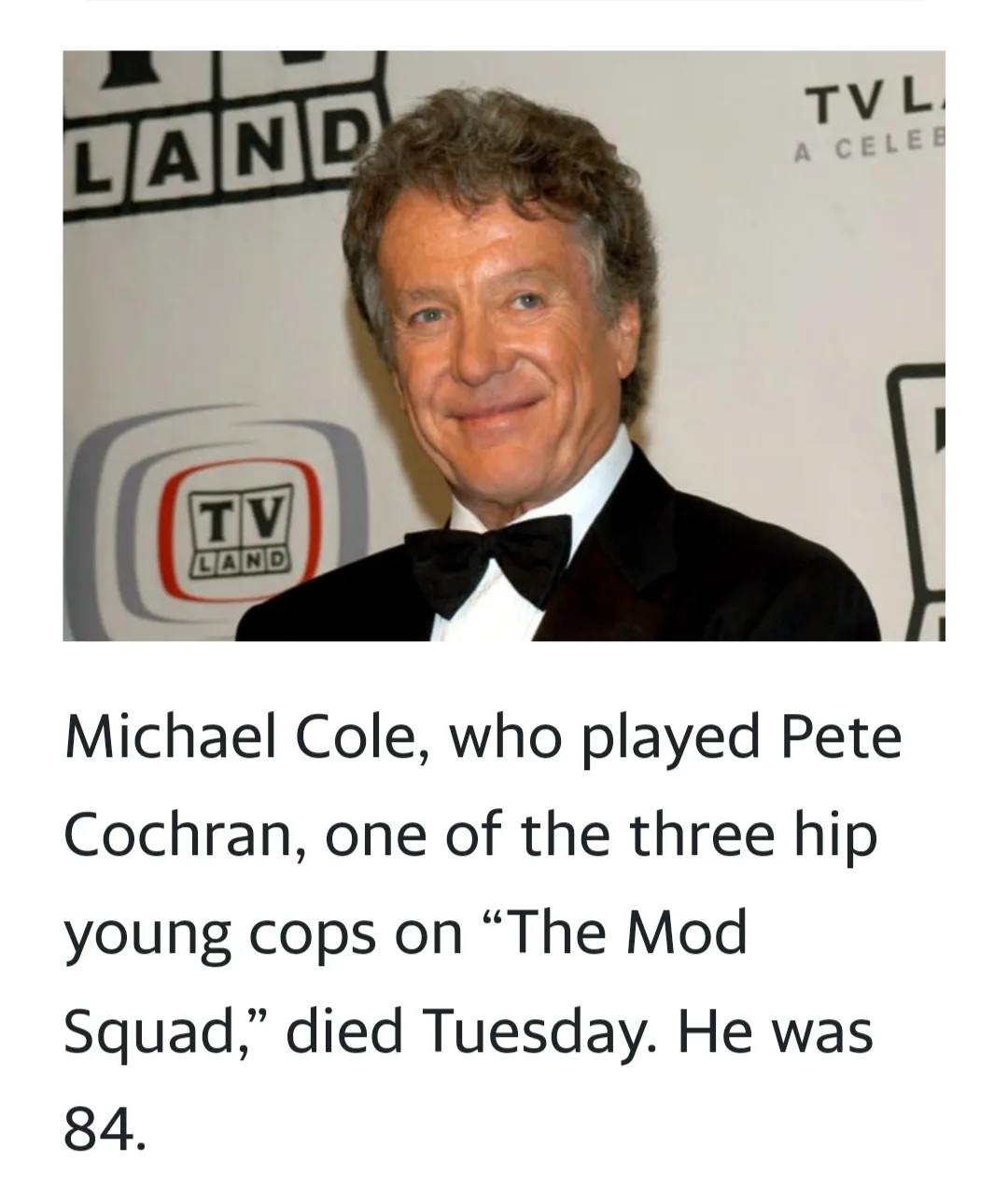 A photo of actor Michael Cole smiling at a TV Land event, wearing a tuxedo and bow tie. Overlaid text announces his death at…
