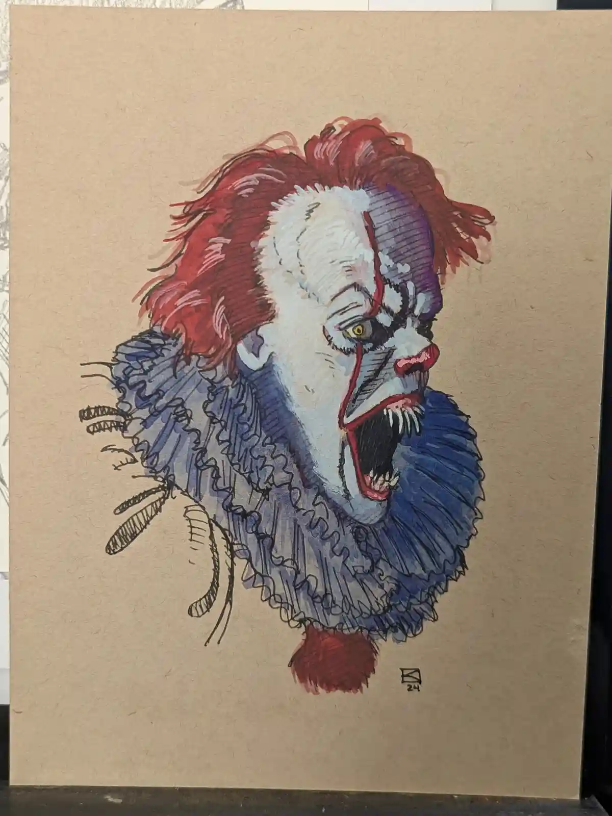 A hand-drawn illustration on textured brown paper depicts Pennywise the clown from Stephen King's 'It,' with wild red hair…