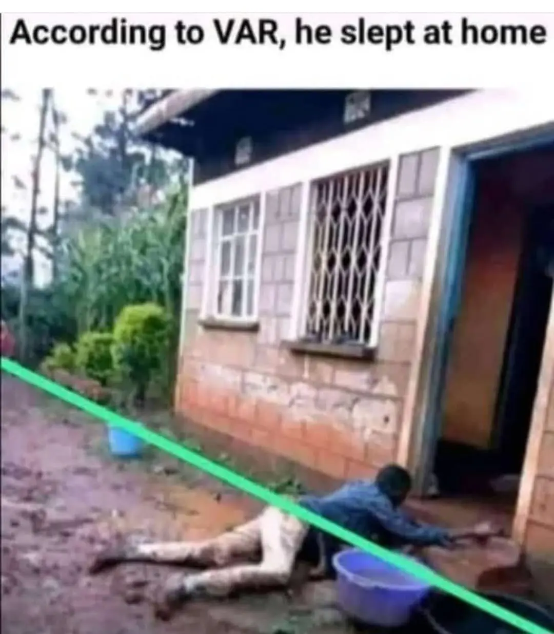 A person is lying on muddy ground outside a house, with a bright green line drawn diagonally across the image, visually…