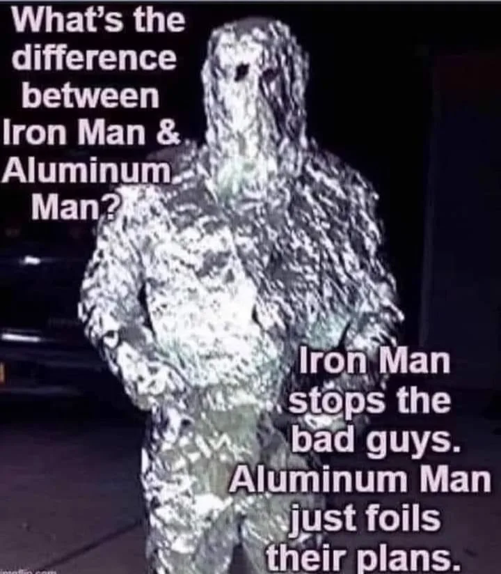 A person is fully covered in crinkled aluminum foil, standing in a dark setting. Text overlaid on the image poses a joke…