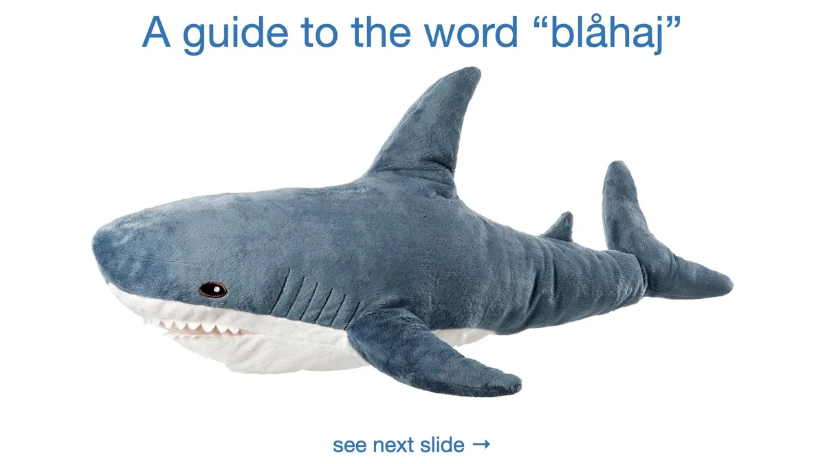 A plush blue shark toy with white underbelly and teeth is shown against a white background. Text at the top reads 'A guide…