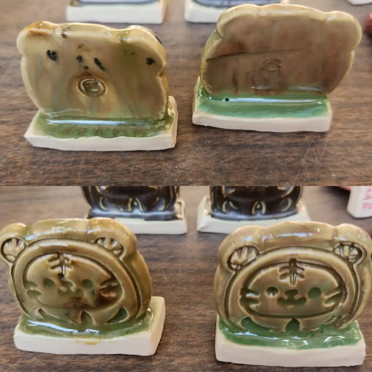 Two ceramic figurines, each showing two contrasting faces: one side is a sad, downturned expression with a single eye, and…