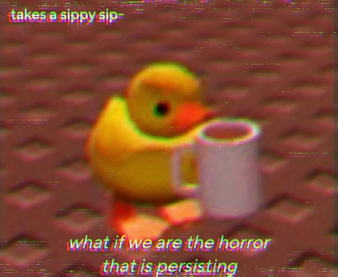 A blurry, glitchy image shows a yellow rubber duck holding a white mug, set against a reddish-brown textured background. The…
