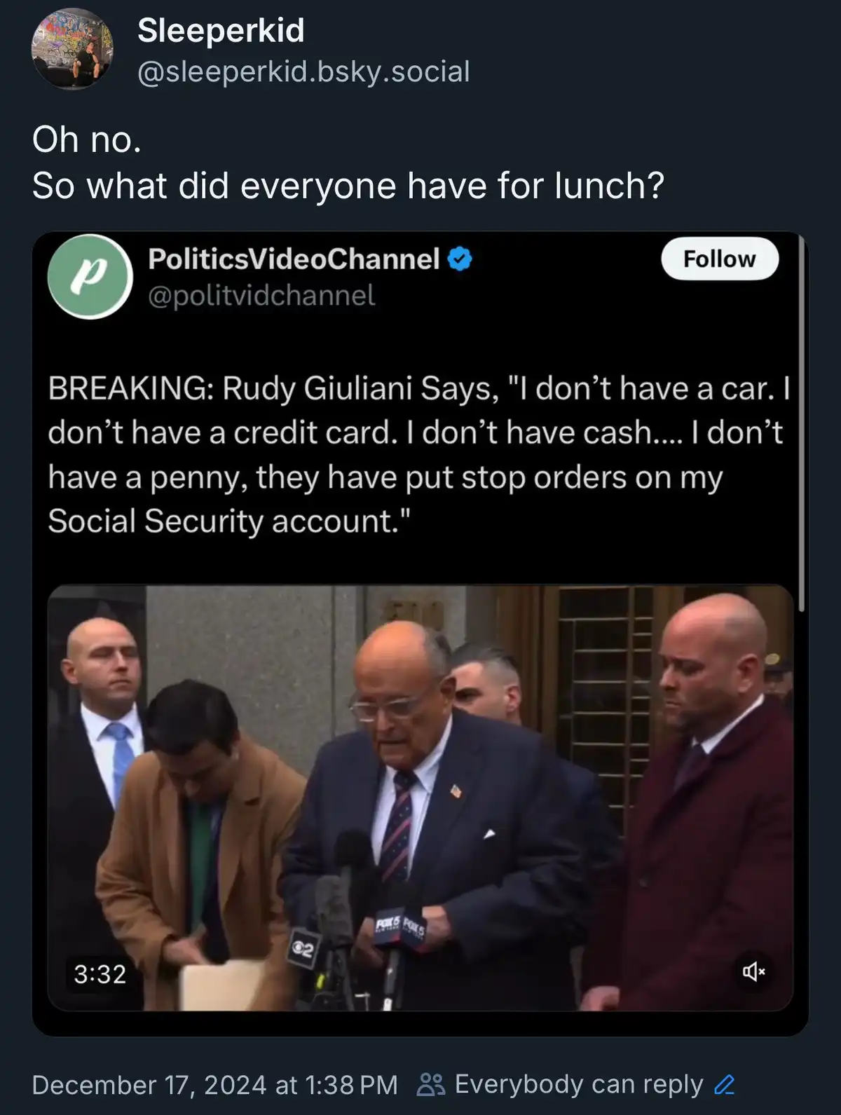 A screenshot of a social media post showing a video of Rudy Giuliani speaking to reporters, surrounded by men in suits. The…