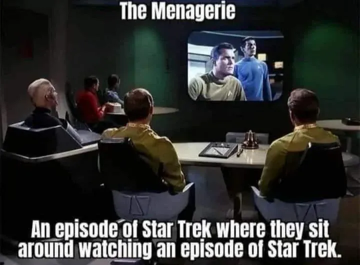 The image shows three men in Star Trek uniforms seated at a console, watching a screen that displays two other men in Star…