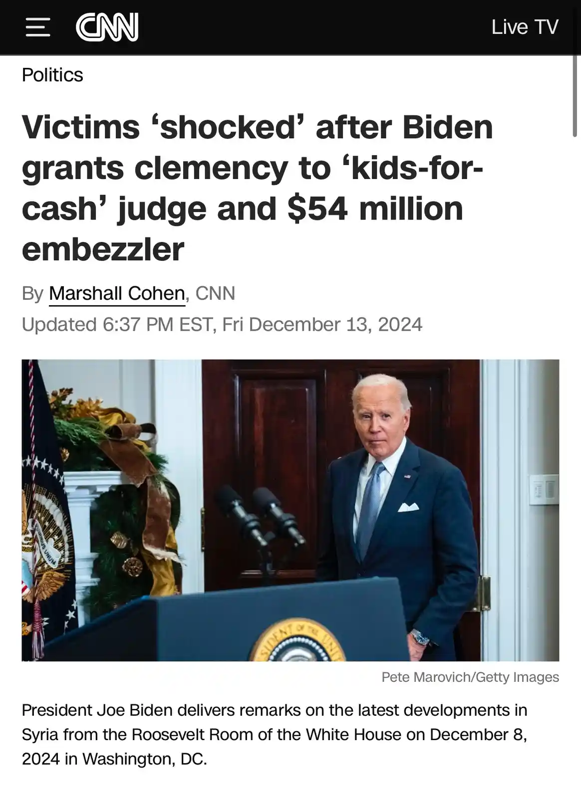 A screenshot of a CNN news article with a headline about President Joe Biden granting clemency to a judge and an embezzler…
