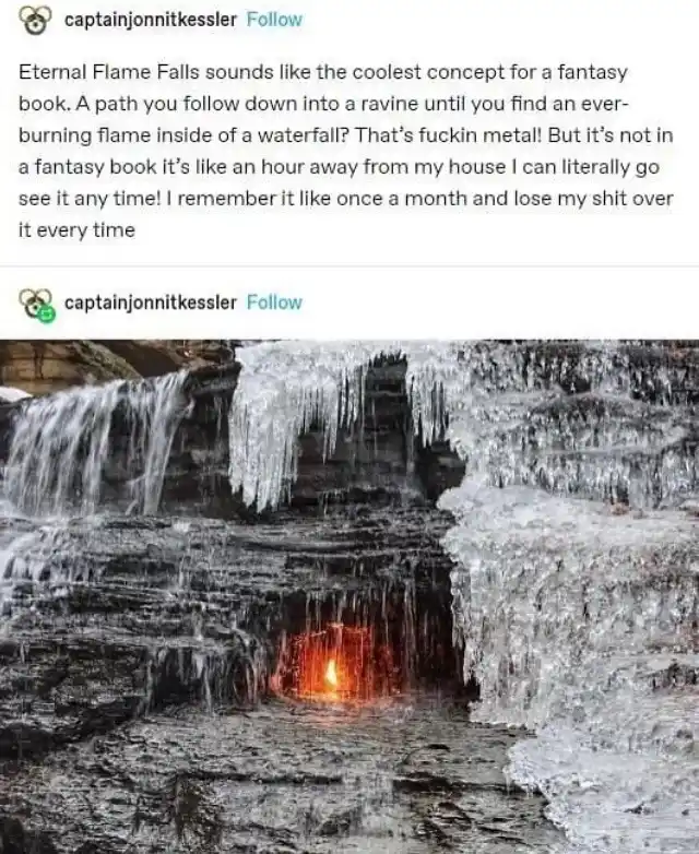 A photograph of a waterfall with icicles hanging from the rocks, and a small, glowing orange flame visible at the base of…