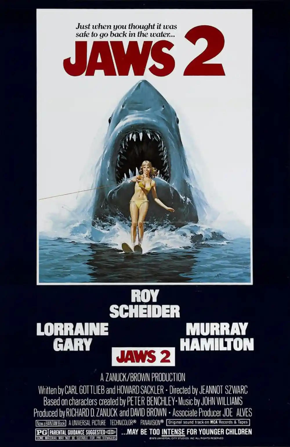 The image is a movie poster for 'Jaws 2' showing a woman in a yellow bikini water skiing while a giant shark with its mouth…