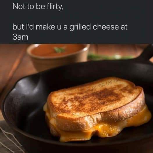 A close-up photo of a golden-brown grilled cheese sandwich with melted cheese oozing out, sitting in a black cast-iron…