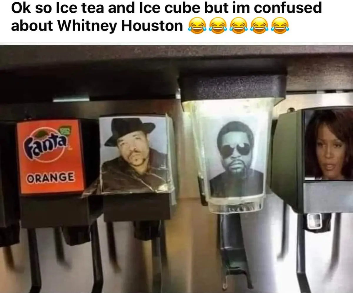 A row of beverage dispensers shows a Fanta Orange machine, then two machines with portraits of Ice-T and Ice Cube, followed…