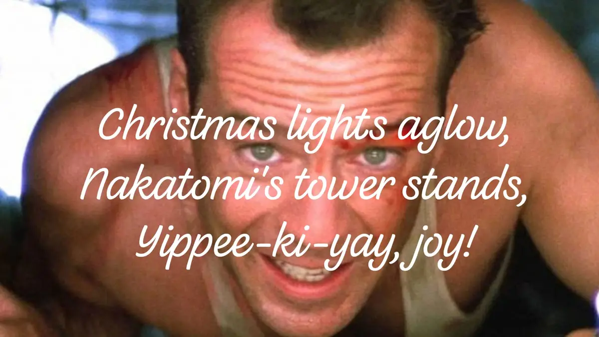 A close-up of a man with a bloodied face and a wide, manic grin, wearing a white tank top. Overlaid white cursive text…