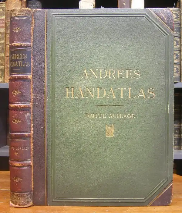 A vintage, well-worn green hardcover book titled 'ANDREES HANDATLAS' with 'DRITTE AUFLAGE' printed below, standing upright…