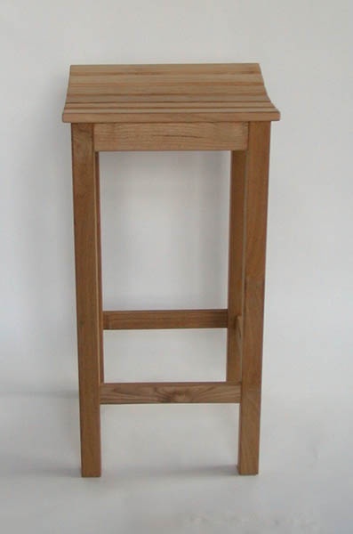 A simple wooden bar stool with four legs and a slatted seat stands against a plain white background. The overlaid text reads…