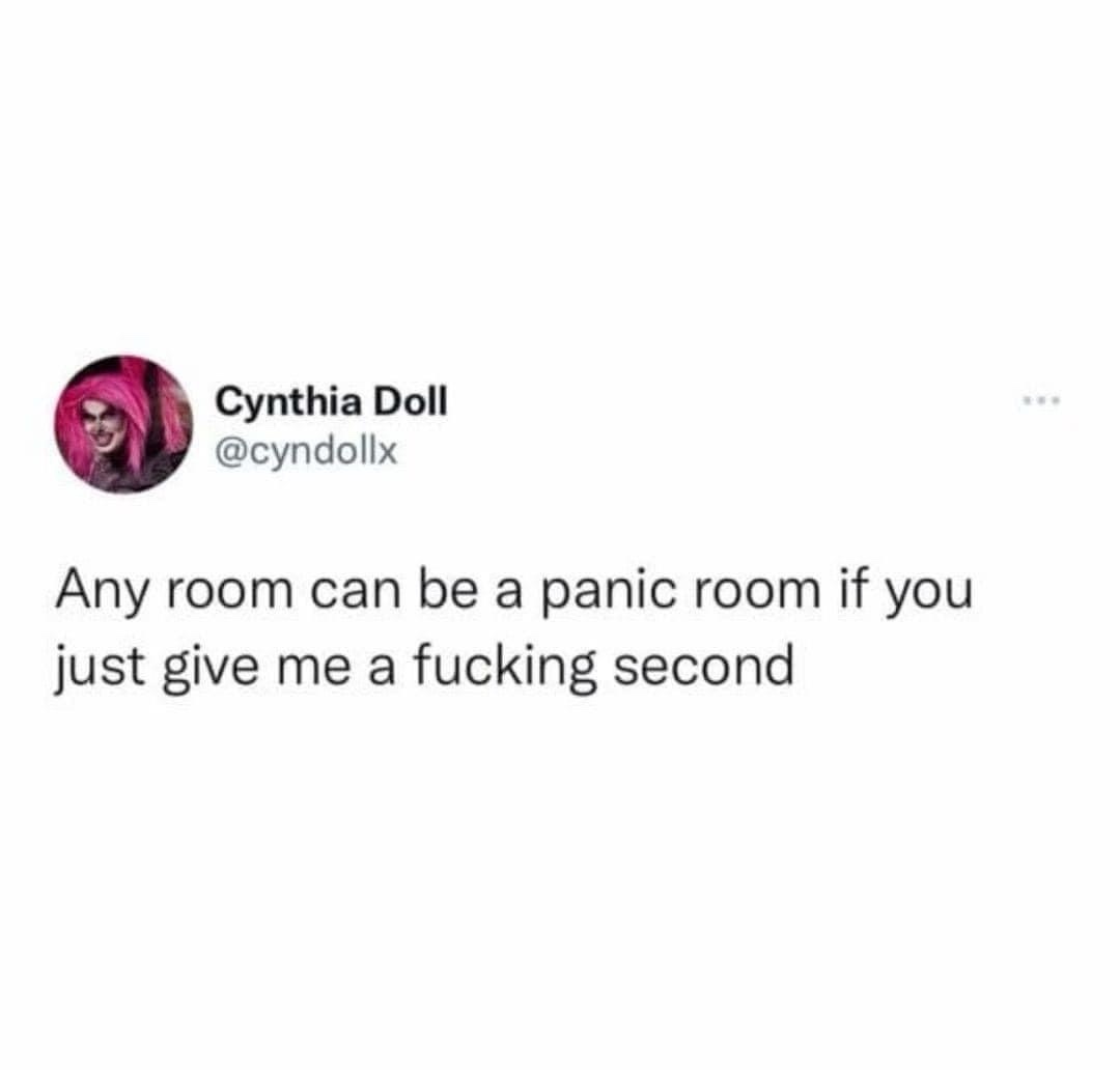 A screenshot of a tweet from user Cynthia Doll (@cyndollx) featuring her profile picture with pink hair and dramatic makeup…