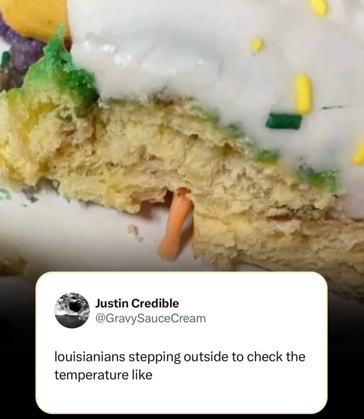 A close-up photo shows a partially eaten cake with white frosting and colorful sprinkles, revealing a small, orange…