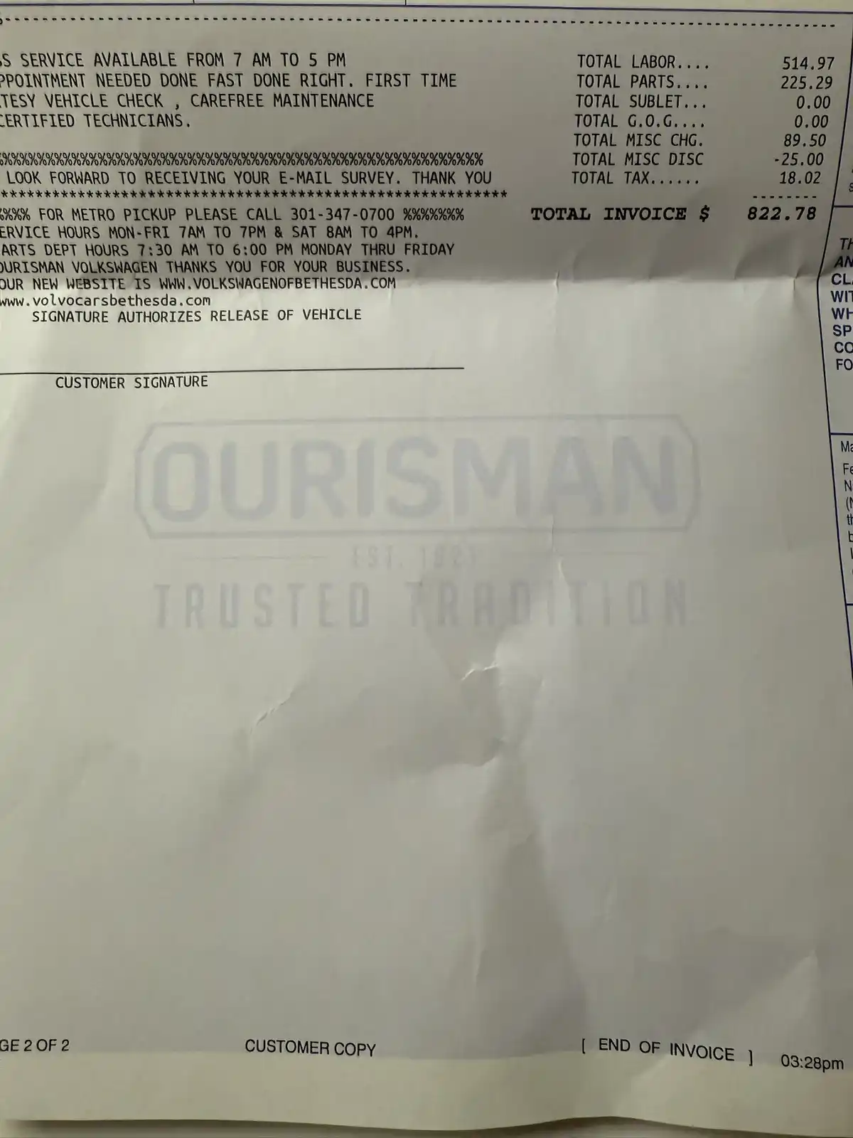 A crumpled customer copy of an Ourisman Volkswagen service invoice showing a total invoice amount of $822.78, with a large…