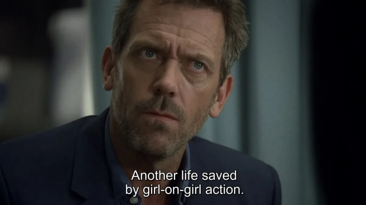 A close-up of actor Hugh Laurie as Dr. Gregory House from 'House, M.D.', looking upward with a skeptical and slightly…