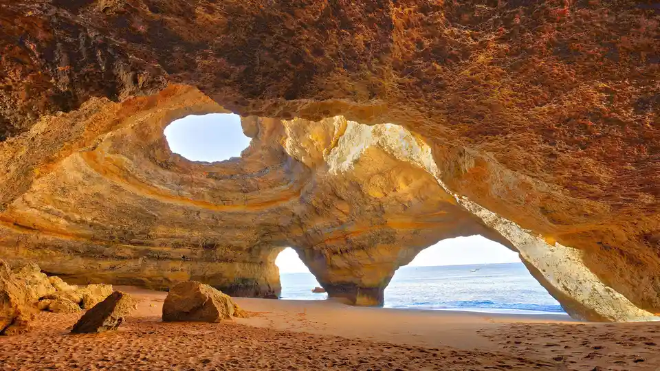 A skylit sanctum: In the Portuguese Algarve, Benagil beach offers a tranquil escape. Rent a boat, kayak, or take a thrilling…