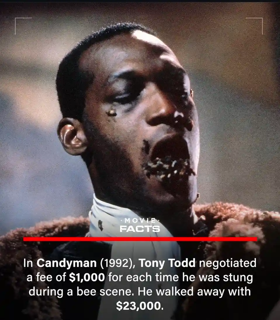 A close-up image of actor Tony Todd from the 1992 horror film Candyman, showing him with bees in his mouth and a stinger…