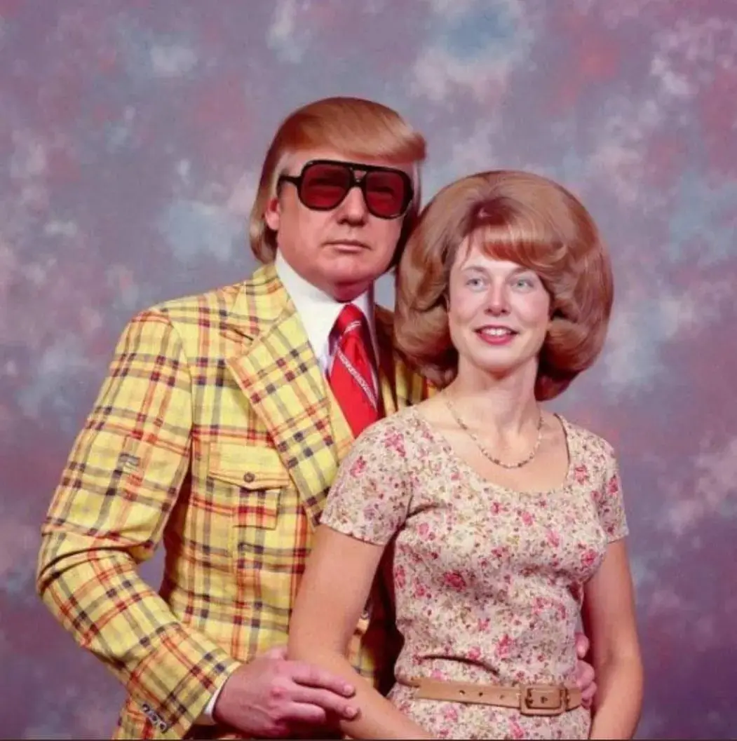A vintage 1970s-style studio portrait shows a man with a distinctive blonde comb-over hairstyle wearing large red-tinted…