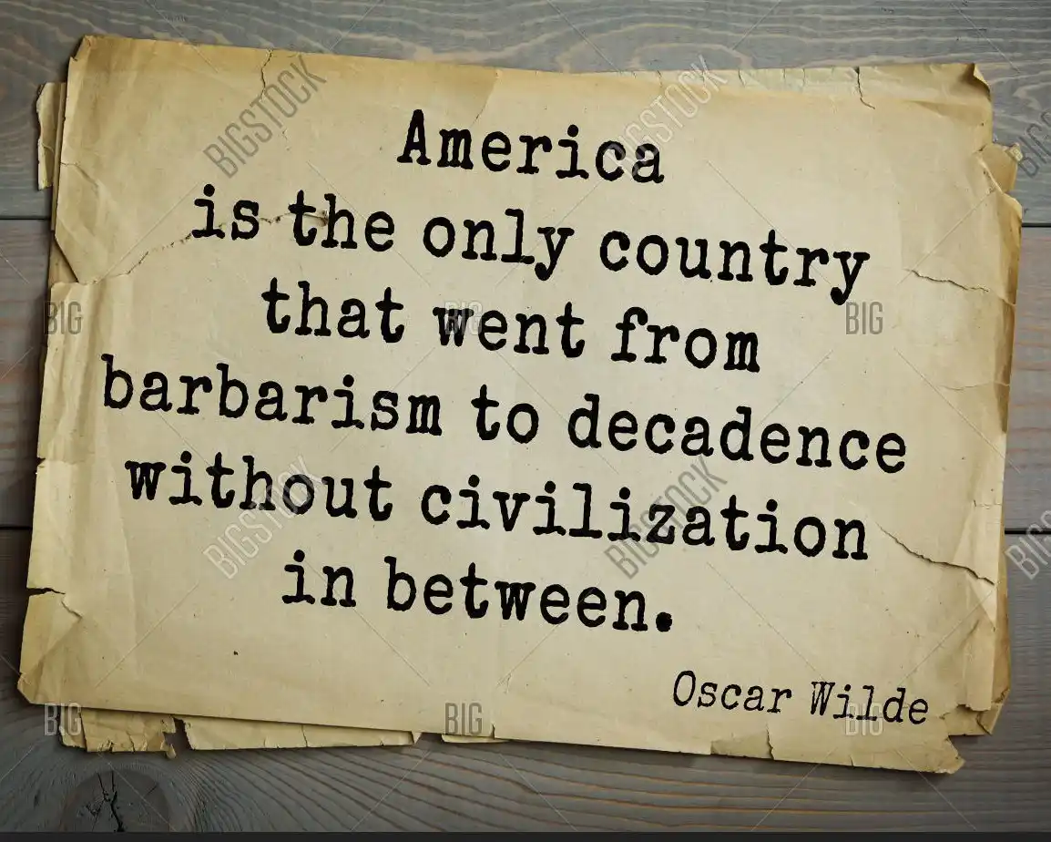A piece of aged, yellowed paper with torn edges lies on a wooden surface, displaying typewritten text that reads: 'America…