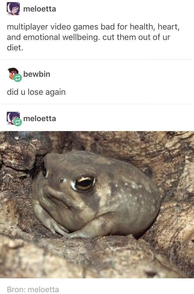 A close-up photo of a small, grayish-brown toad with a visibly sad, downturned mouth and droopy eyes, nestled in a crevice…